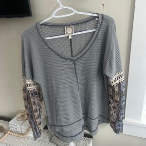Elegant Gray Knit Top with Patterned Sleeves